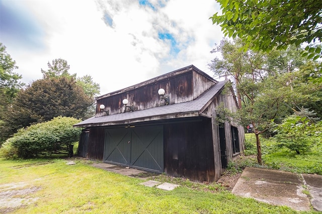 view of outdoor structure with a lawn