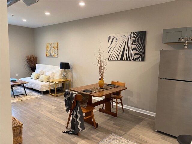 dining room with light hardwood / wood-style floors