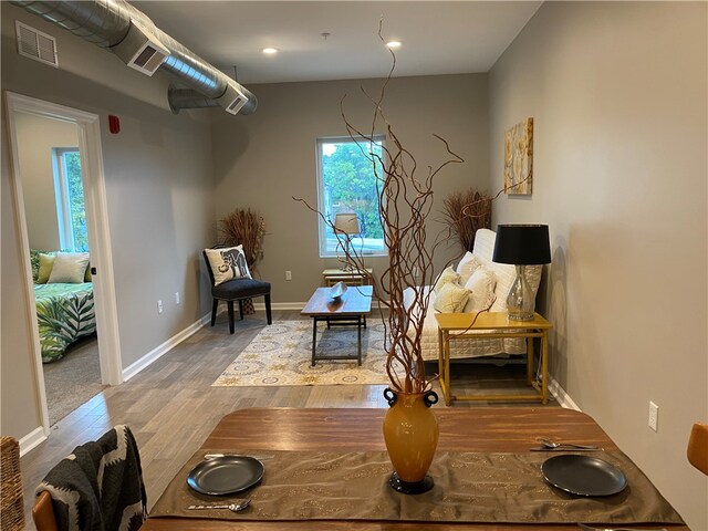 living area featuring hardwood / wood-style floors and plenty of natural light