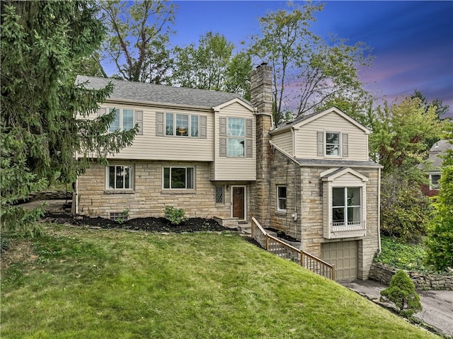 view of front of home with a lawn