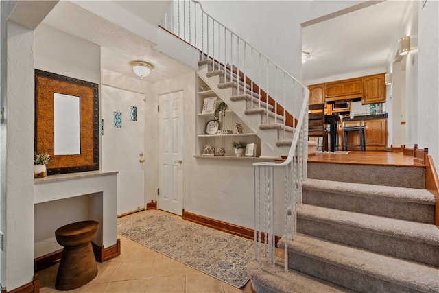 entrance foyer with light tile patterned flooring