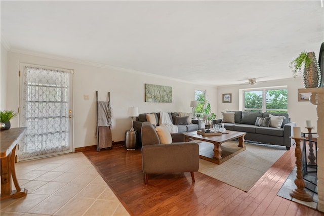 living room featuring light wood-type flooring, ceiling fan, and crown molding