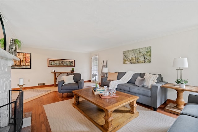 living room featuring crown molding and light hardwood / wood-style floors