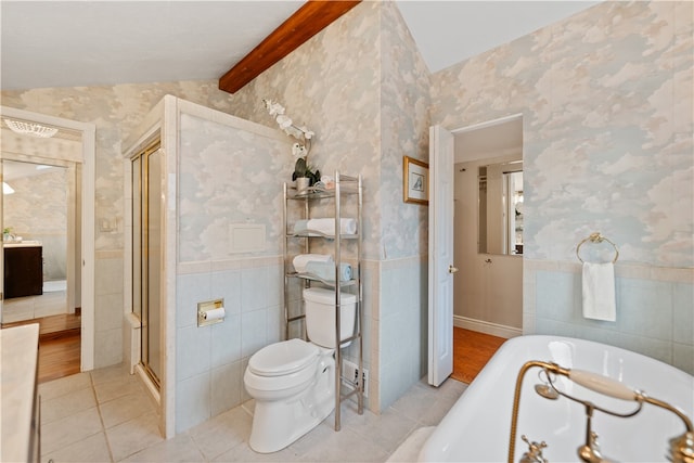 bathroom featuring vaulted ceiling with beams, tile patterned flooring, plus walk in shower, tile walls, and toilet