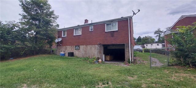 3126 Orris Rd N, Versailles, PA 15137 - rear view of house with brick siding, a chimney, central AC unit, and a garage