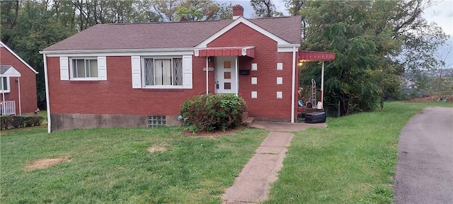3126 Orris Rd N, Versailles, PA 15137 - view of front facade with a front yard, brick siding, a chimney, and a shingled roof
