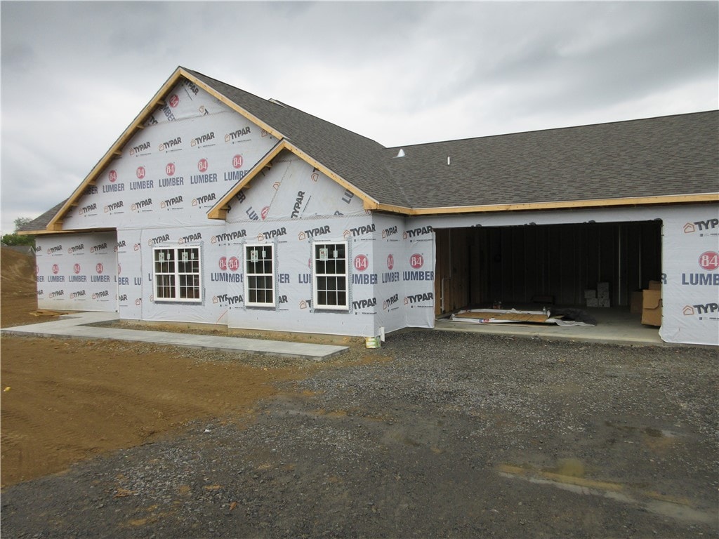 property in mid-construction with a garage