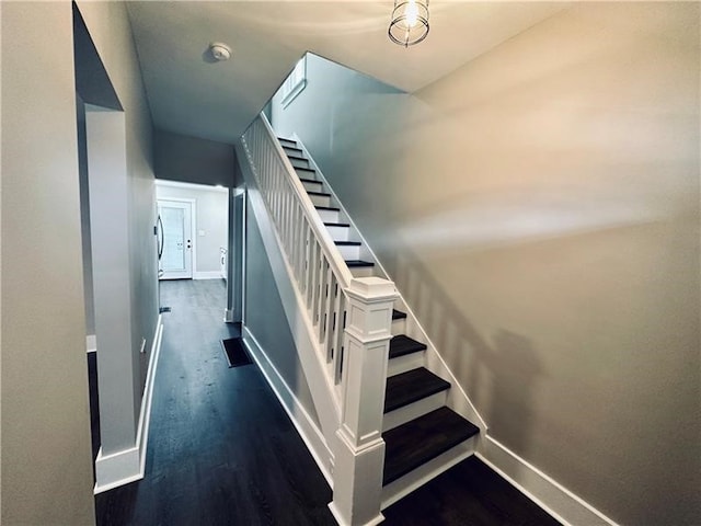 stairs with wood-type flooring