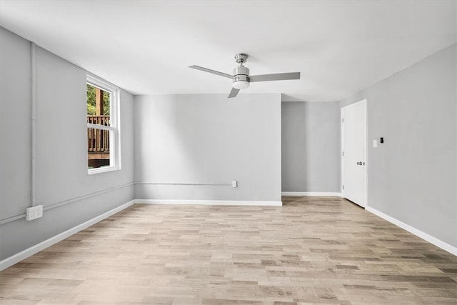 empty room with light wood-type flooring and ceiling fan