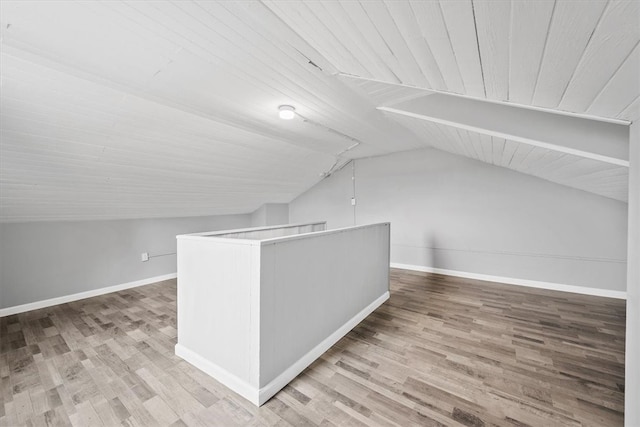 bonus room featuring wood-type flooring, vaulted ceiling, and wooden ceiling