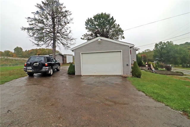 garage featuring a yard