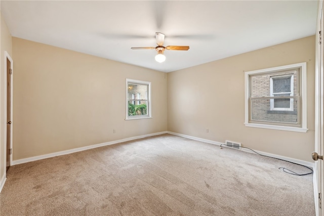 carpeted empty room with ceiling fan