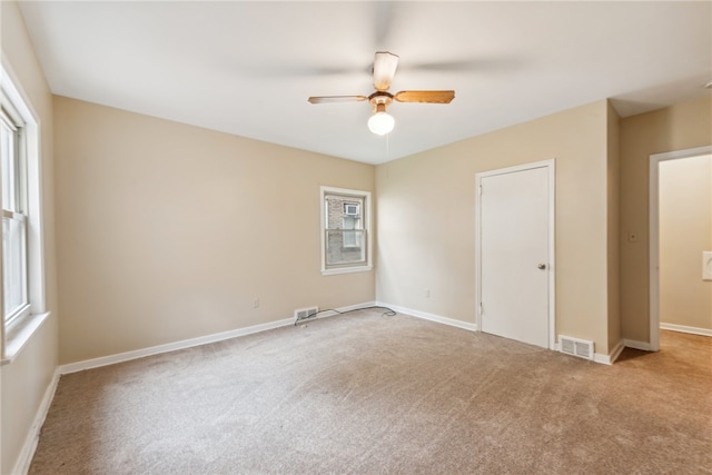 unfurnished bedroom featuring ceiling fan and light colored carpet