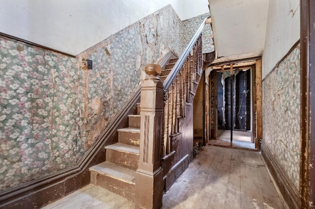 stairway featuring hardwood / wood-style flooring