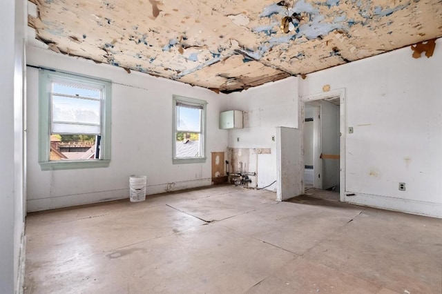 373 Stewart St, Turtle Creek, PA 15145 - unfurnished room with healthy amount of natural light and unfinished concrete floors