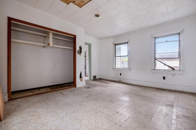 unfurnished bedroom with a closet