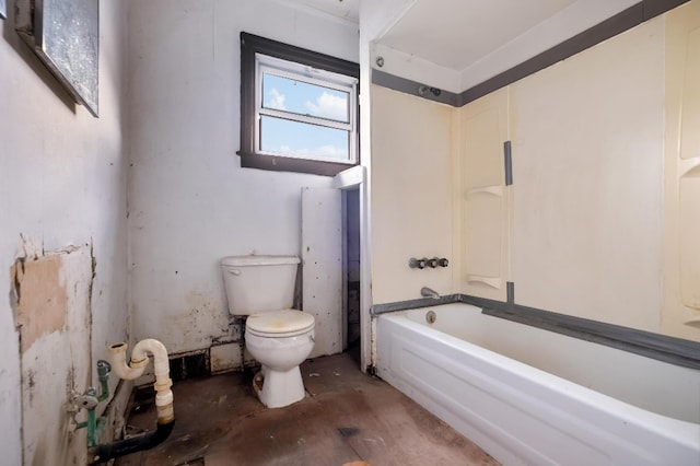 bathroom with wood-type flooring, a tub to relax in, and toilet