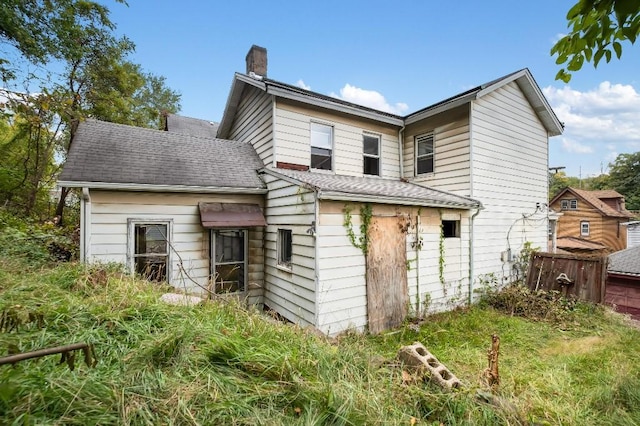 373 Stewart St, Turtle Creek, PA 15145 - rear view of property featuring a chimney and roof with shingles