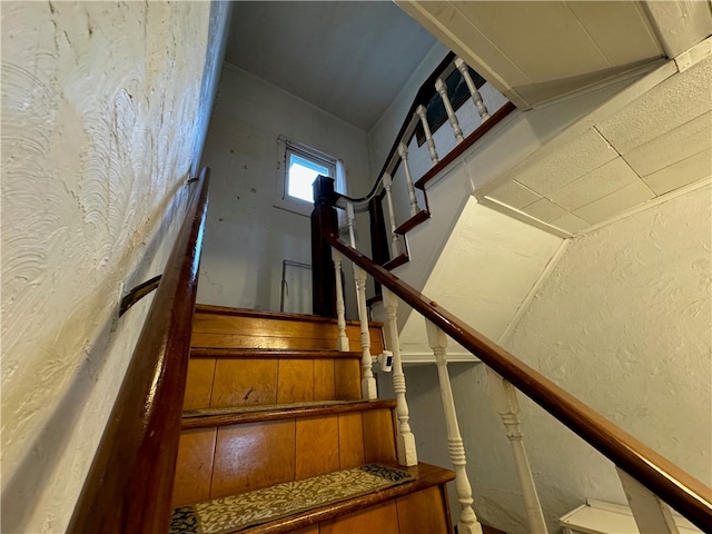 stairs with lofted ceiling