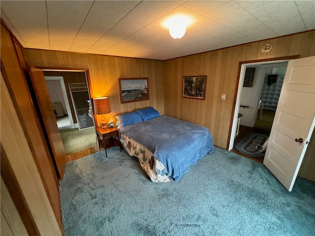 carpeted bedroom featuring wooden walls