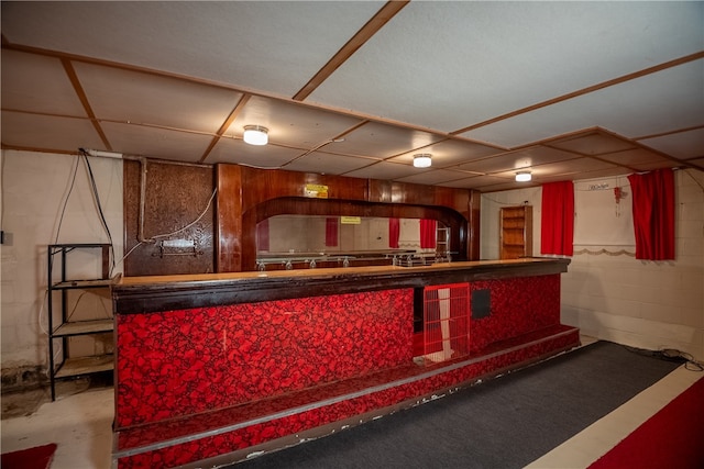 bar featuring concrete floors