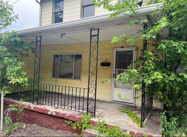 doorway to property with a porch