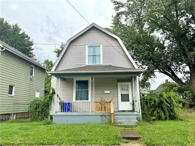 bungalow featuring a front yard and a porch