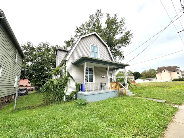 exterior space with a front yard and a porch