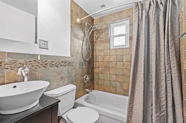 full bathroom featuring tile walls, shower / bathtub combination with curtain, toilet, and vanity