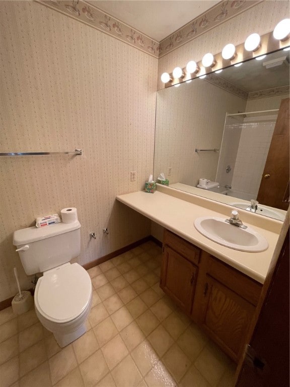 bathroom featuring vanity, toilet, and a shower with curtain