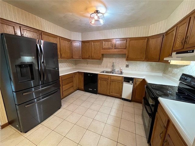 kitchen with black appliances, sink, light tile patterned floors, and tasteful backsplash