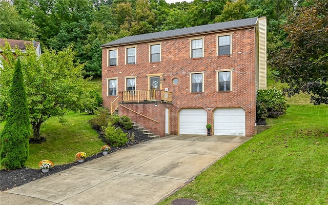 view of front of home with a garage and a front lawn