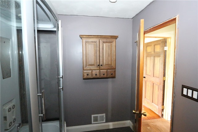 bathroom featuring wood-type flooring