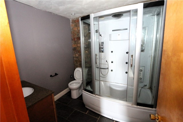 bathroom featuring tile patterned flooring, vanity, and toilet