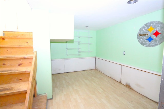 interior space featuring white cabinets and light hardwood / wood-style flooring