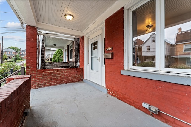 doorway to property featuring a porch