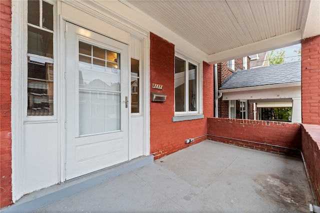 doorway to property featuring a porch