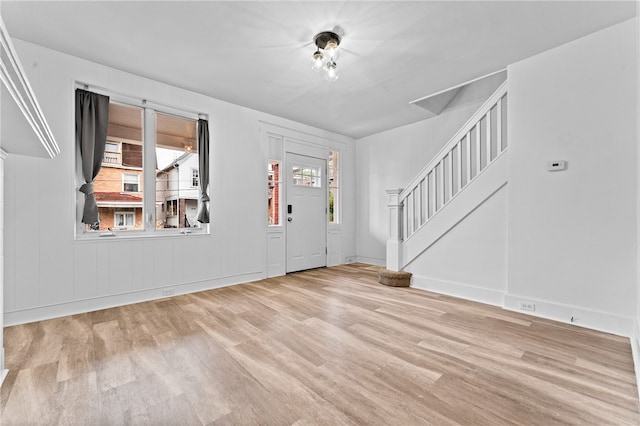 foyer entrance with light hardwood / wood-style flooring