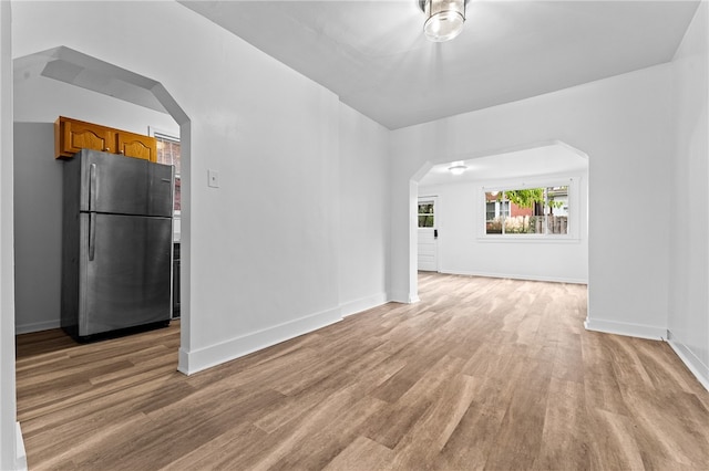 spare room featuring light wood-type flooring