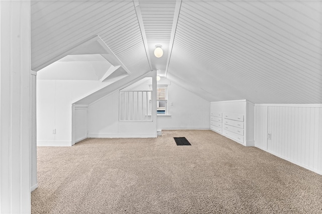 bonus room featuring carpet and lofted ceiling