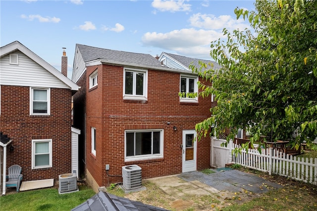 back of property featuring a patio area and central AC