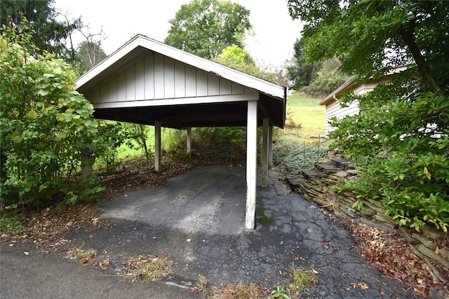 view of parking / parking lot featuring a carport