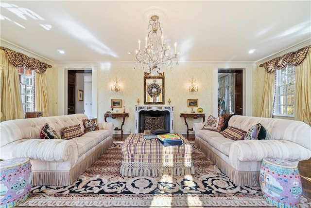 living room featuring hardwood / wood-style floors, a chandelier, and ornamental molding