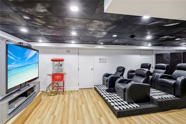 home theater room featuring hardwood / wood-style flooring