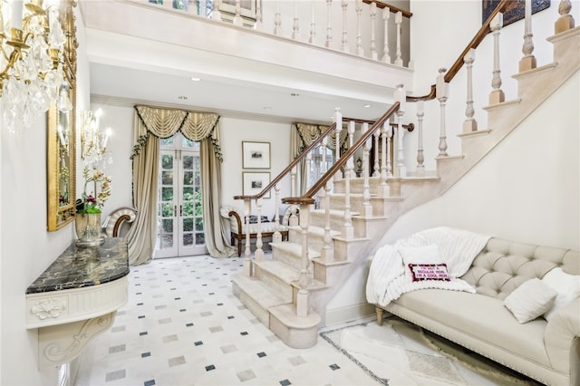 stairway featuring ornamental molding