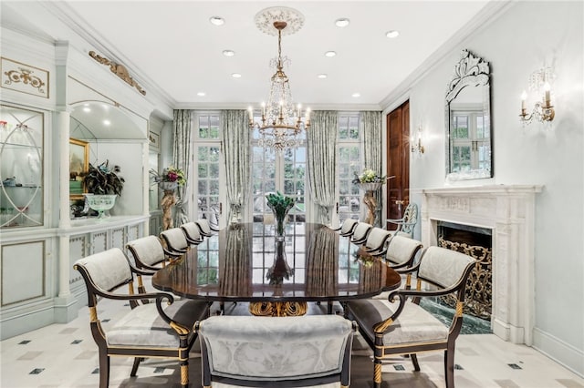 dining space with an inviting chandelier, ornamental molding, and a wealth of natural light