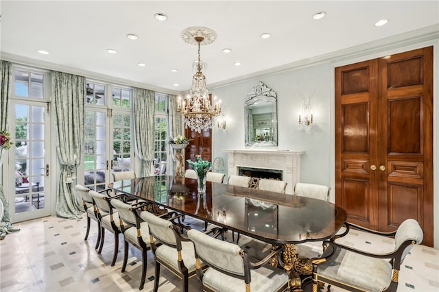 dining area featuring crown molding and a chandelier