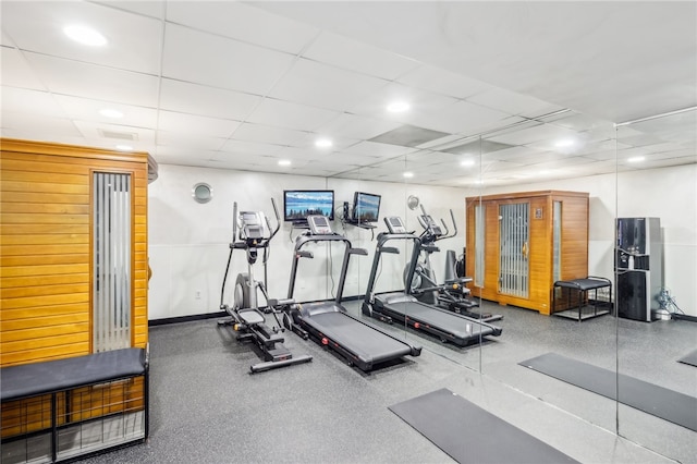 workout area featuring a drop ceiling