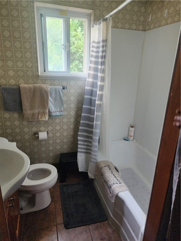 full bathroom with shower / bath combo, vanity, toilet, and tile patterned floors