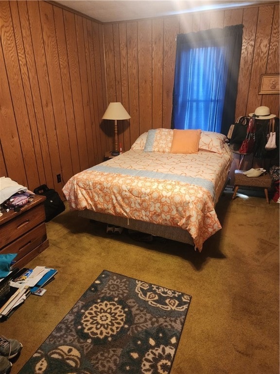 carpeted bedroom with wooden walls